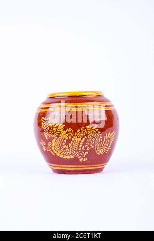 Glazed water jar with dragon pattern from Thailand for home interiors on white background Stock Photo
