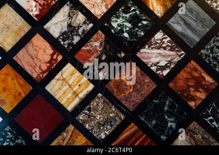 Old vintage wall with multicolored marble squares textured background structure Stock Photo
