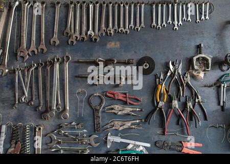 Wrench, Pliers, Clamps. A lot of tools mechanic on old wooden board background. Stock Photo