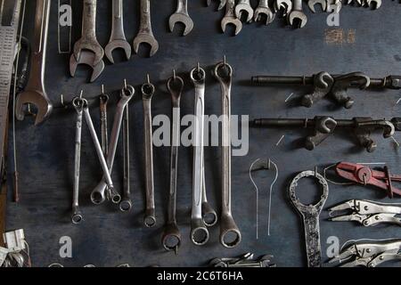 Wrench, Pliers, Clamps. A lot of tools mechanic on old wooden board background. Stock Photo