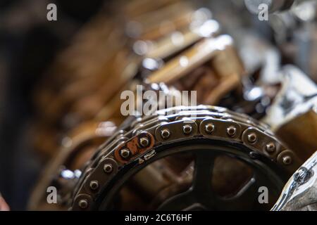 Close up chain camshaft timing of engine on blur camshaft backgrpound. Stock Photo