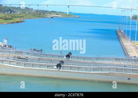 The Panama Canal is an artificial 48-mile (77 km) waterway in Panama that connects the Atlantic Ocean with the Pacific Ocean. Stock Photo