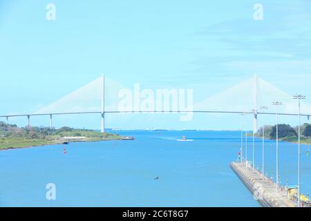 The Panama Canal is an artificial 48-mile (77 km) waterway in Panama that connects the Atlantic Ocean with the Pacific Ocean. Stock Photo