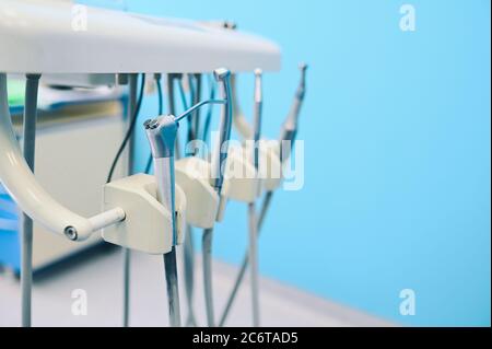Different professional dental equipment, instruments and tools in a dentists stomatology office clinic. Stock Photo