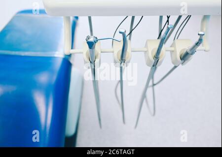 Different professional dental equipment, instruments and tools in a dentists stomatology office clinic. Stock Photo