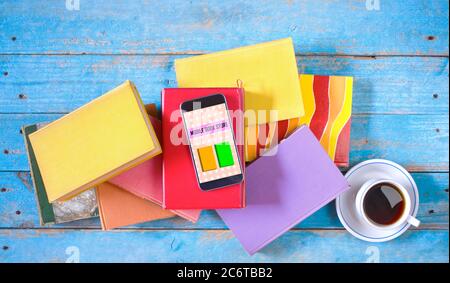 Stack of books and smartphone. online book shop, E- Book, book fair, reading,education concept. Stock Photo
