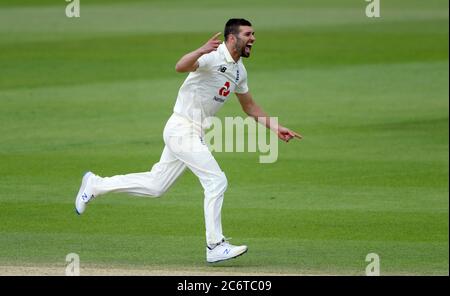 England's Mark Wood celebrates taking the wicket of West indies Shai Hope during day five of the Test Series at the Ageas Bowl, Southampton.