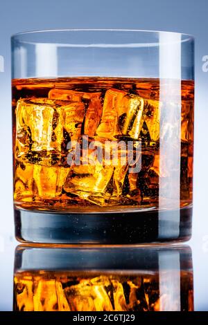 Bright orange drink glass water ice cubes refreshing Stock Photo