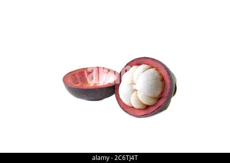 Mangosteen and cross section showing the thick purple skin and white flesh of the queen of friuts Stock Photo