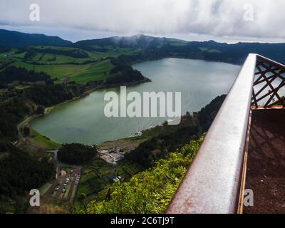 aerial view from top of Pico do Ferro on beautiful blue green crater lake Lagoa das Furnas and village Furnas with vulcanic thermal area. Sao Miguel Stock Photo