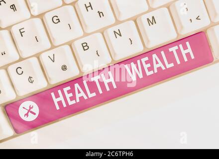 Writing note showing Health Wealth. Business concept for healthy mind and body can bring you wealth and happiness Colored keyboard key with accessorie Stock Photo