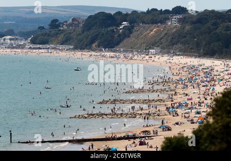 Bournemouth, UK. 12th July 2020.  Beautiful dsy on the beach at Poole in Dorset on a sunny Sunday. Credit: Richard Crease/Alamy Live News Stock Photo