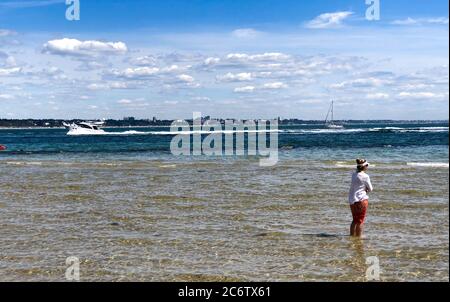 Studland, UK. 12th July 2020.  Plenty of space and spectacular views from Studland beach overlooking Poole Bay on the Dorset Coast.  Credit: Richard Crease/Alamy Live News Stock Photo