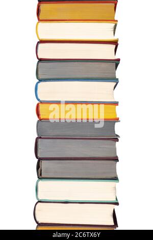 Stack of hardcover books on bookshelf. Close up view of multi colored vintage hardback books isolated on white background. Stock Photo