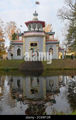 Tsarskoe Selo, Russia - October 20, 2019: People near Chinese pavilion in Catherine park. Built in 1778-1786 in Chinoiserie style, the pavilion also known as Creaking arbor Stock Photo