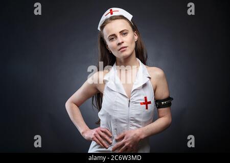 Photo of slim young woman in fake doctor costume