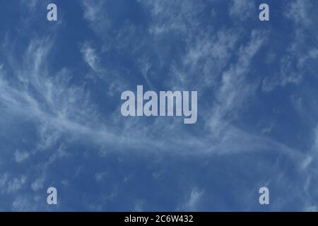 Cirrus clouds in a deep blue sky Stock Photo