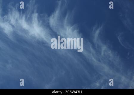 Cirrus clouds in a deep blue sky Stock Photo