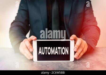 Word writing text Automation. Business photo showcasing equipment in production systems or other manufacturing processes Model displaying black screen Stock Photo