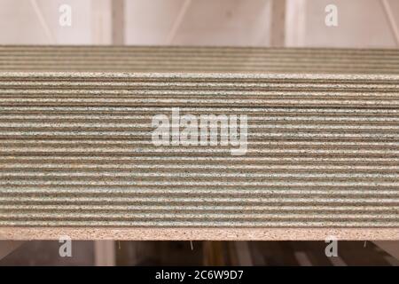 OSB wooden chipboard sheets stacked in store Stock Photo