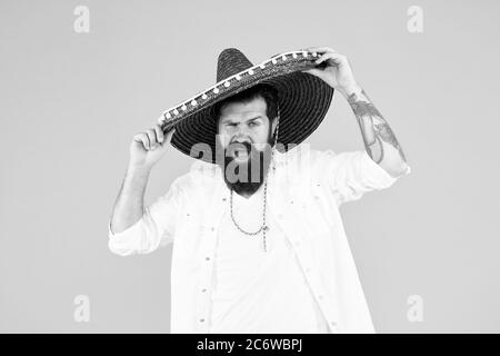 Having mexican soul. Mexican traditions. Explore mexican culture. Celebrate traditional holiday. Happy man sombrero souvenir straw hat. Plan summer vacation. Tourism concept. Hipster having fun. Stock Photo