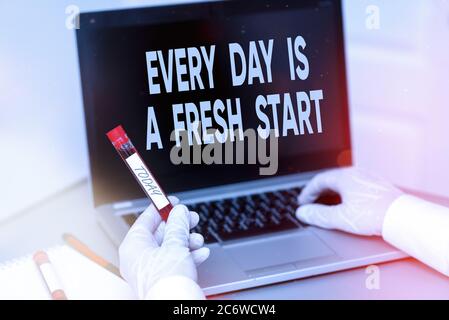 Handwriting text Every Day Is A Fresh Start. Conceptual photo an opportunity to start over without prejudice Extracted blood sample vial with lastest Stock Photo