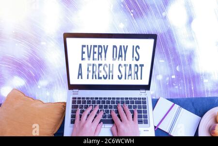 Handwriting text writing Every Day Is A Fresh Start. Conceptual photo an opportunity to start over without prejudice Modern gadgets with white display Stock Photo