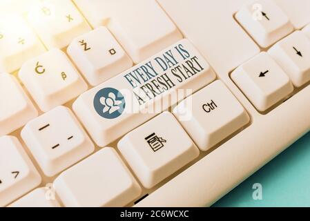Conceptual hand writing showing Every Day Is A Fresh Start. Concept meaning an opportunity to start over without prejudice Pc keyboard key with note p Stock Photo