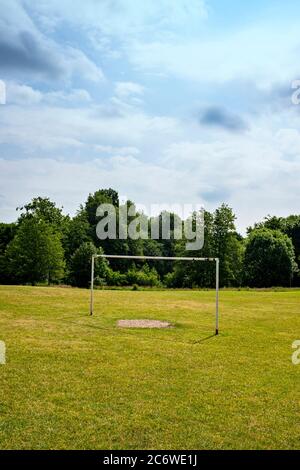 White football goal post on a football pitch in a public park Stock Photo