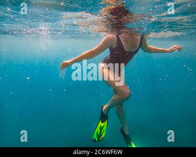 woman in flipper view underwater beach vacation Stock Photo