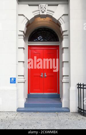 Red doors of P.S. 158 Bayard Taylor School, a Beaux-arts style public school built in the 19th century in the Upper East Side of New York City. Stock Photo
