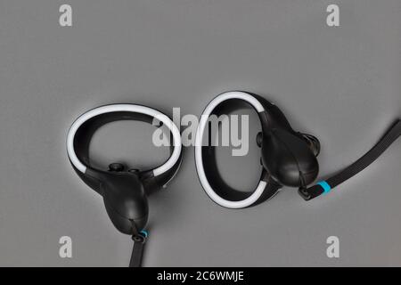 Virtual reality controllers with a led light on gray background Stock Photo