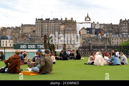 Edinburgh, Scotland, UK. 12 July, 2020, Business slowly returning to normal in Edinburgh city centre. Tourists still almost non existent and streets remain very quiet in the Old Town. Outdoor seating on Princes Street at Neighbourhood beer garden . Iain Masterton/Alamy Live News Stock Photo