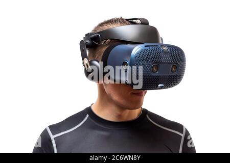The smiling man with the virtual reality helmet, isolated on white background Stock Photo
