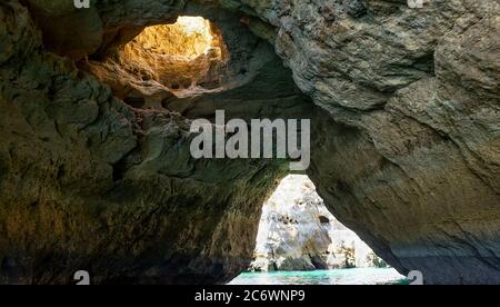 Albufeira, Portugal - July 11, 2020: A group of tourist in a boat visiting the caves of Benagil Stock Photo