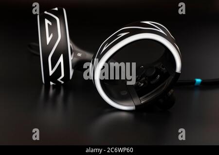 Virtual reality controllers with a glow of light on black background Stock Photo