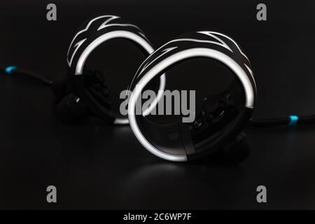 Virtual reality controllers with led light on black background Stock Photo