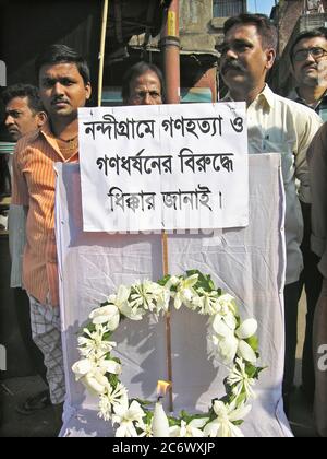 A rally against the brutality in Nandigram, at a street, in Kolkata, India. November 14, 2007. In 2007 the West Bengal government decided to allow ‘Salim Group’, an Indonesian conglomerate, to set up a chemical hub at Nandigram under the ‘Special Economic Zone’, SEZ, policy. This led to resistance by the villagers resulting in clashes with the police that left 14 dead and accusation of police brutality. Source: www.wikipedia.com Stock Photo