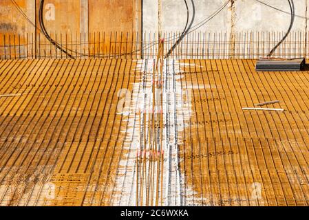Steel rebar, ready for concrete to be poured. Concrete casting preparation and layout for steel rebar. Stock Photo