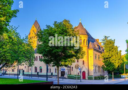 Koblenz, Germany, August 23, 2019: Court of Appeal Oberlandesgericht Rhineland Palatinate building with clock tower in historical city centre, twilight evening view, Rhineland-Palatinate state Stock Photo