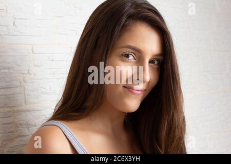 Profile portrait of Lovely beautiful girl looking in camera. Isolated on white background Stock Photo