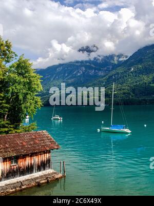 Turquoise Lake Brienz is a lake just north of the Alps, set amid the spectacular mountain scenery of the Bernese Oberland, Interlaken, Switzerland Stock Photo