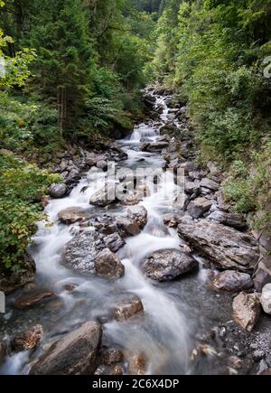 Alpine Mountain Creek, Alpine Stream in the Swiss Alps, Interlaken, Switzerland Stock Photo