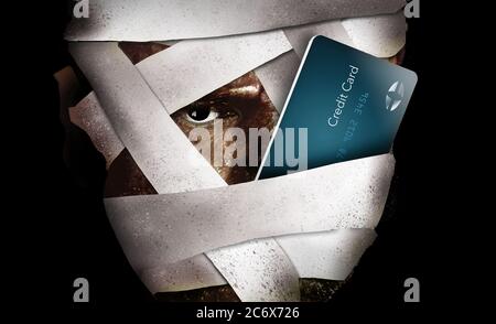 A man with face in bandage is seen with a credit card in this illustration about medical expenses, insurance and payment. Stock Photo