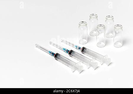 Medical vials and syringes on a white background Stock Photo - Alamy