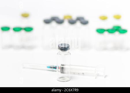 Template of hypodermic syringe and medical vials isolated on white background. Close-up Stock Photo