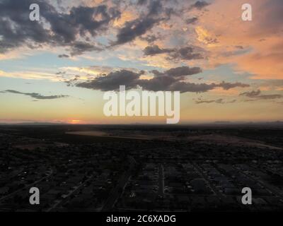 Aerial image of a community neighborhood in Arizona as the sun is setting. Stock Photo