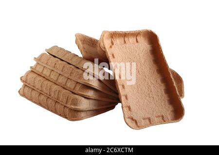 Biodegradable food trays made from pressed cardboard isolated on white background. Closeup Stock Photo