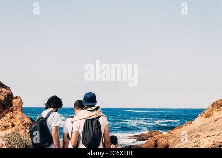 Group of young people walk to the beach in the Mediterranean. Concept of going to the beach Stock Photo