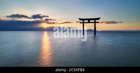 Long exposure shot of Shirahige shrine Torii gate at sunrise, Lake Biwa, Shiga Prefecture, Japan Stock Photo